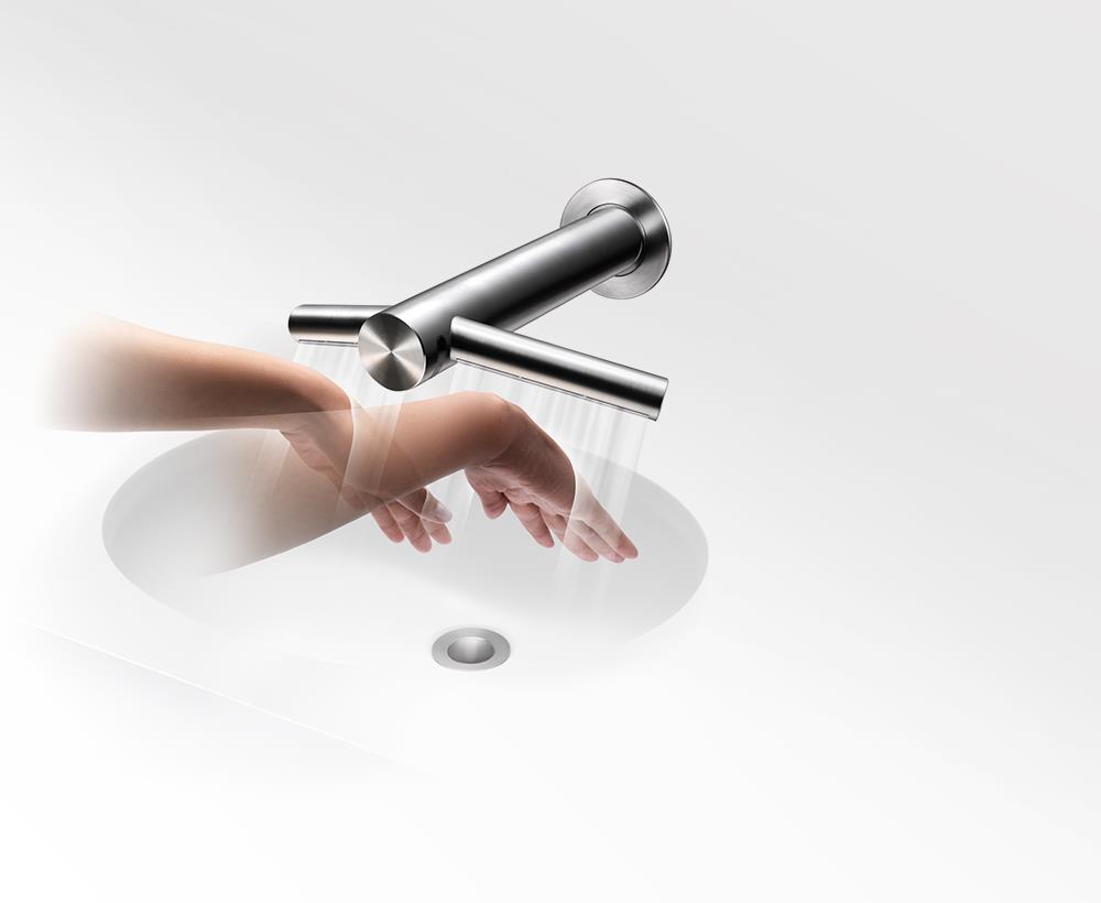 The Dyson Airblade Tap hand dryer drying hands